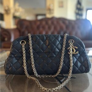 a Chanel Just Mademoiselle Bowling bag